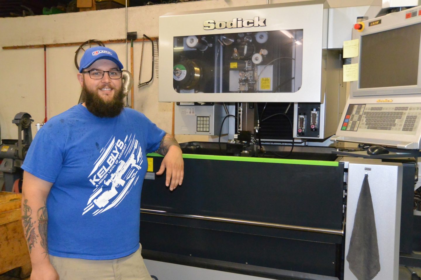 Ian Kelbly with the wire EDM machine used to "cut" the bolt races