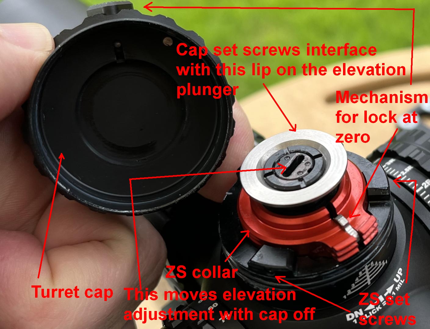 Primary Arms Optics GLx 3-18x44 elevation turret with cap removed to show zero stop mechanism