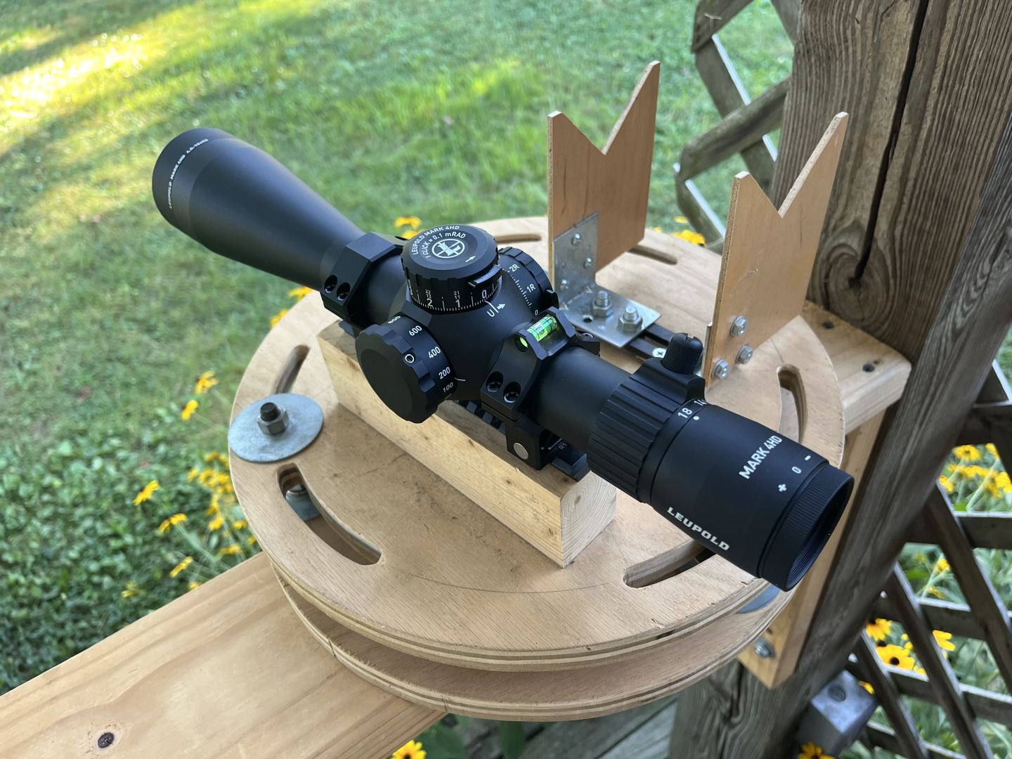 The Leupold Mark 4HD 4.5-18x52 strapped into the test apparatus for its mechanical testing.