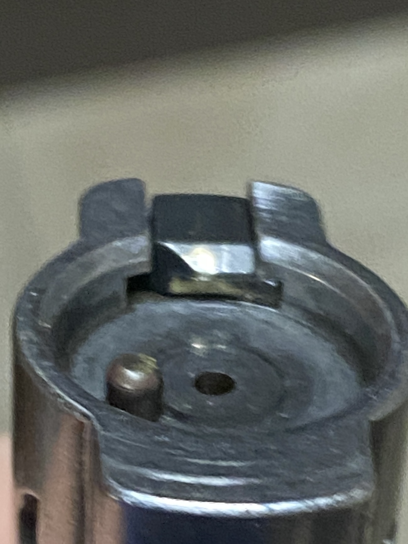Instax wide 300 broken ejector arm. Any idea of how to fix this? It seems  that a small piece broke from the arm and it is no longer connecting with  the metal