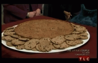 a-huge-cookie-as-a-surprise-and-he-reacts-with-that-oh-you-shouldnt-have-indicating-he-loves-it.gif