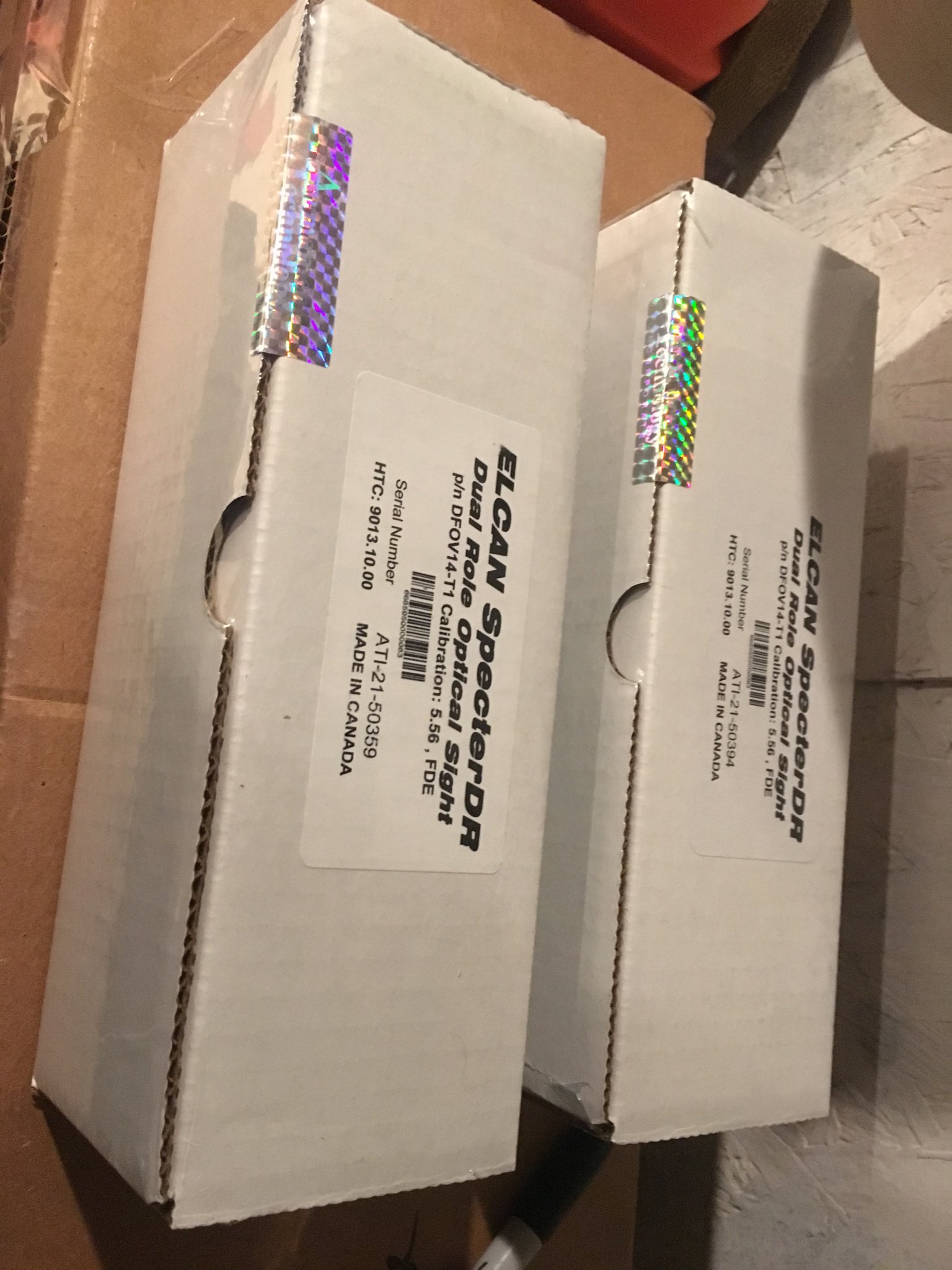 7076877
