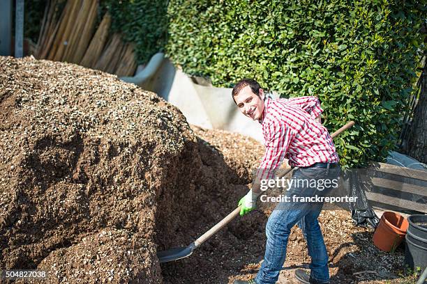 farmer-man-shoveling-the-manure-2680126814.jpg