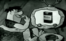 fred-flintstone-smoking-a-cigarette.gif