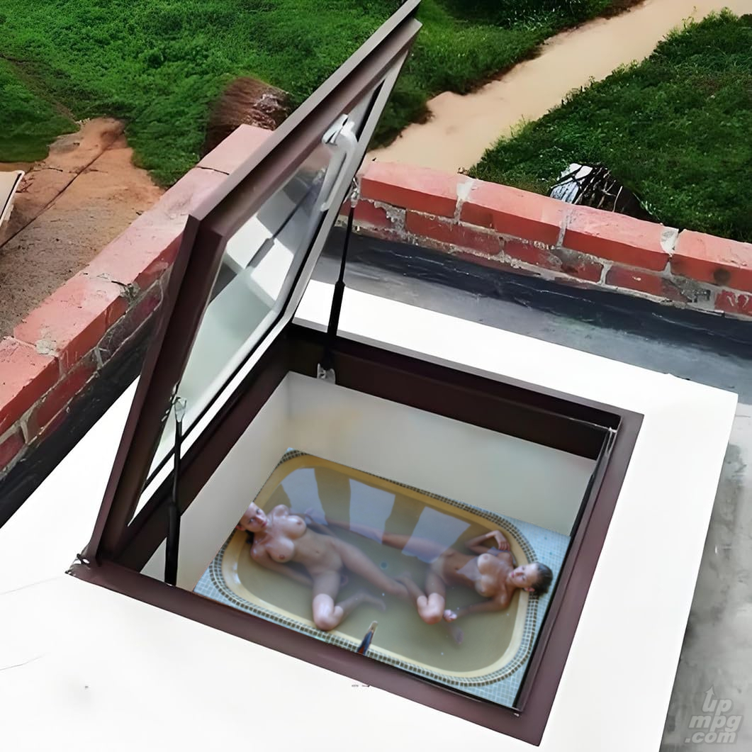 girls_nude_soaking_in_tub_together_seen_from_above.jpg