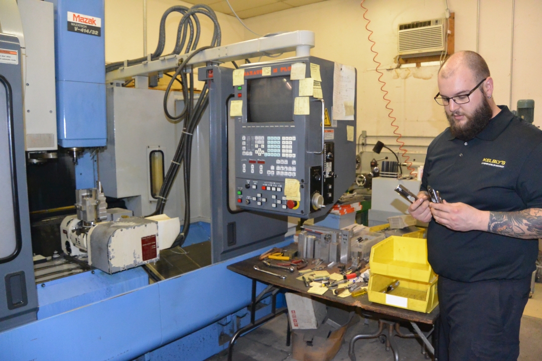 Ian with CNC machine.jpg