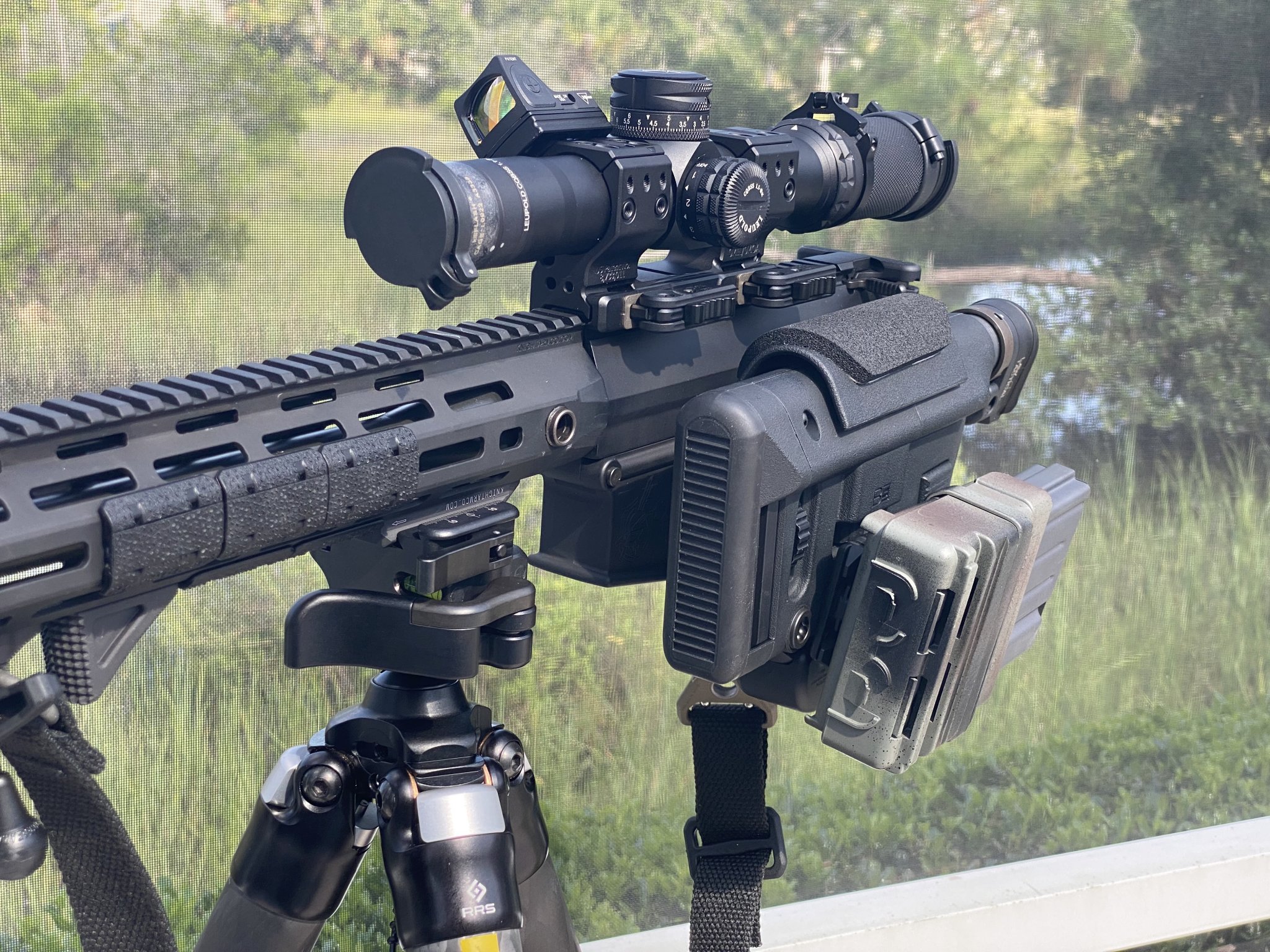 IMG_0170KAC SR-25 WITH SUPPRESSOR BLACK SCOPE & SLING RMR MOUNTED POOLSIDE 07.30.21 copy.jpg
