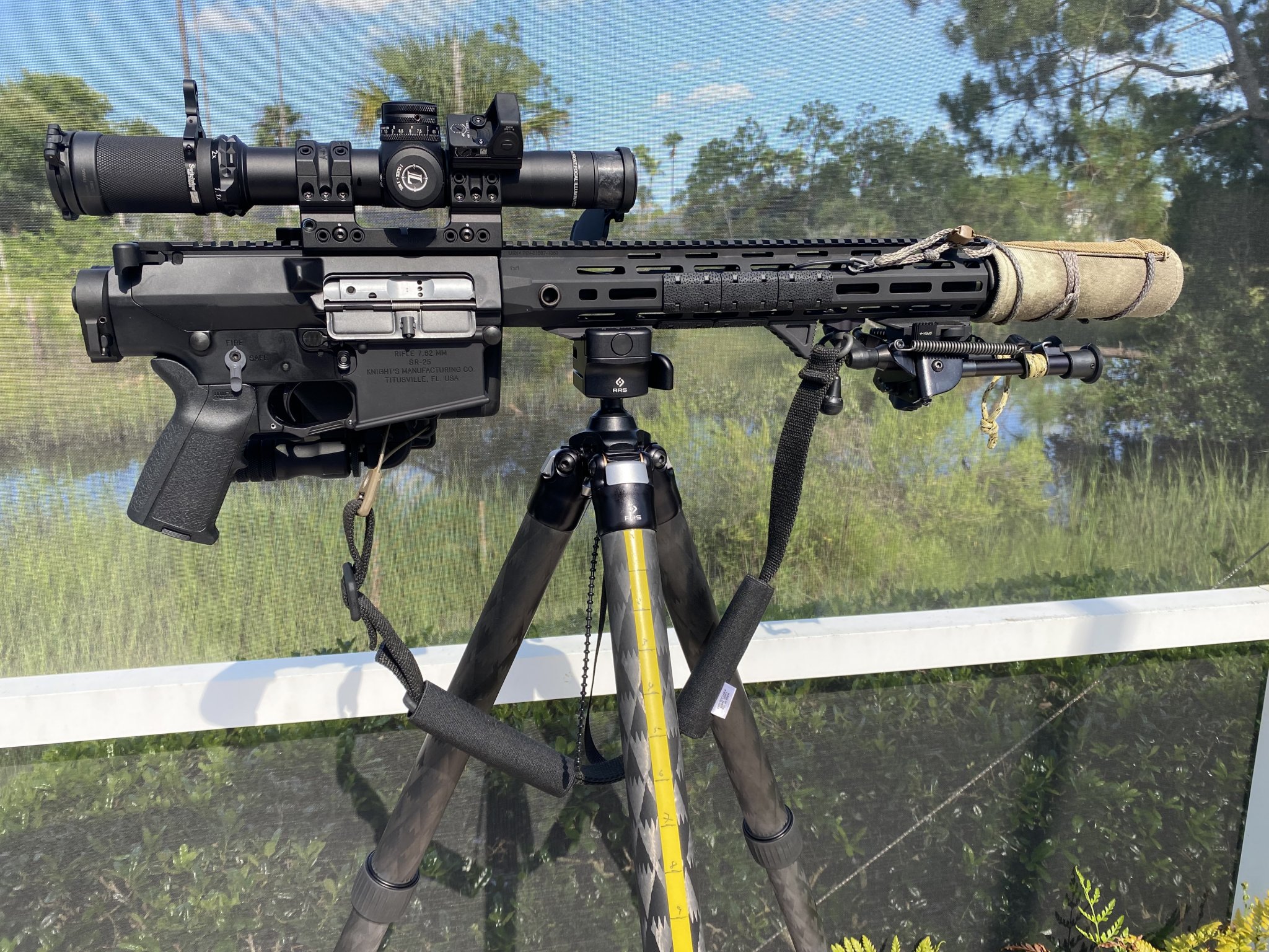 IMG_0185KAC SR-25 WITH SUPPRESSOR BLACK SCOPE & SLING RMR MOUNTED POOLSIDE 07.30.21 copy.jpg