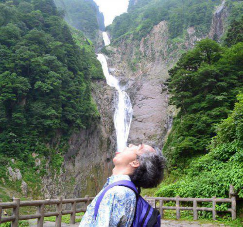 Man-Drinking-Waterfall-1360848408.jpg