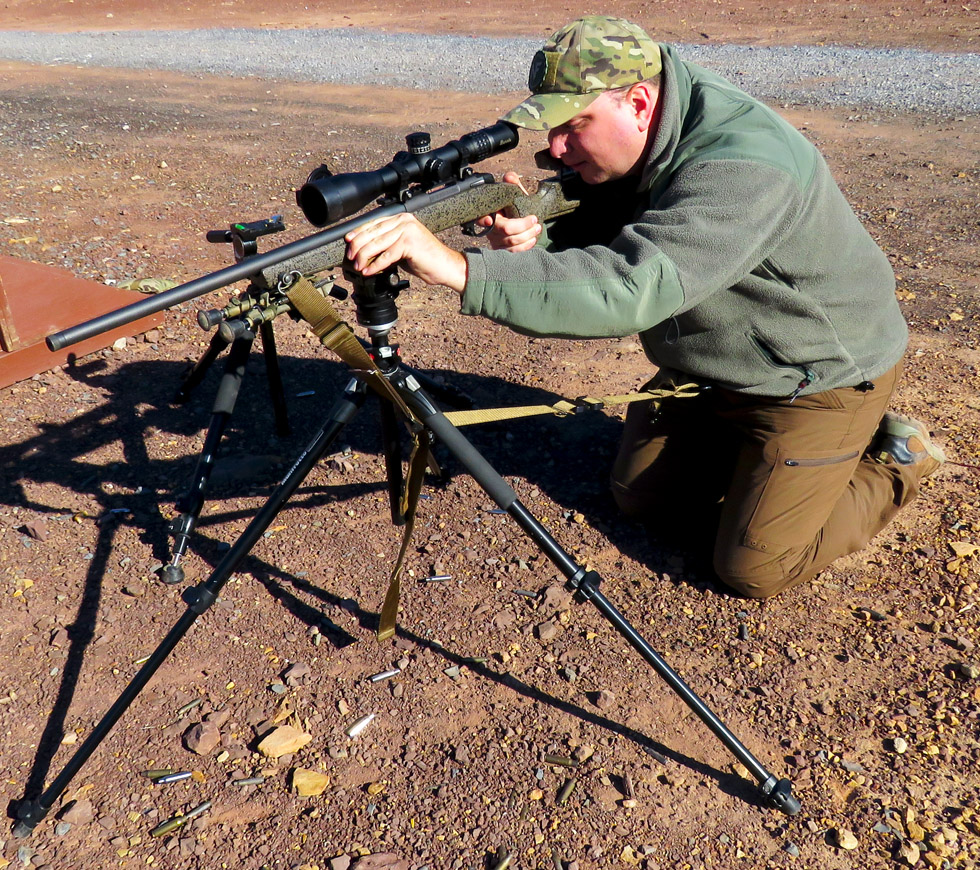 The carabineer loop in action off of a Manfroto tripod.  Note the sling routed under the tripo...JPG