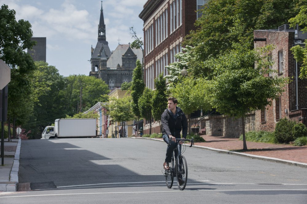 tom-clancy's-jack-ryan-2018-003-john-krasinski-cycling-through-quiet-town-ORIGINAL.jpg