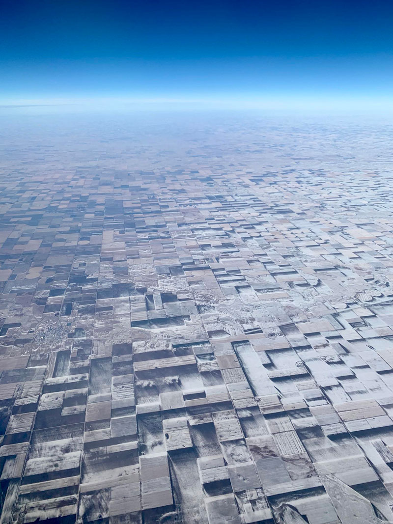windblown-snow-makes-flat-farmland-look-3d-from-above.jpg