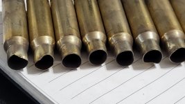 308 brass ejected from stock LMT MWS 20 in SS barrel with Omeag 300 mounted..jpg