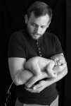 Four-day-old-baby-Ted-poops-on-father-Al-Fergusons-arm.jpg